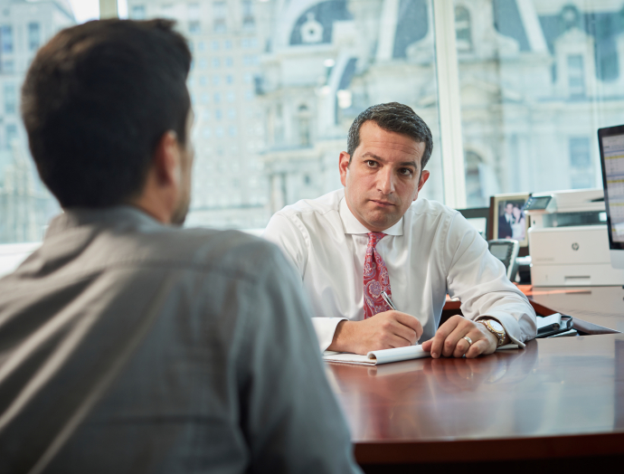 Levin Attorneys Talking to a client