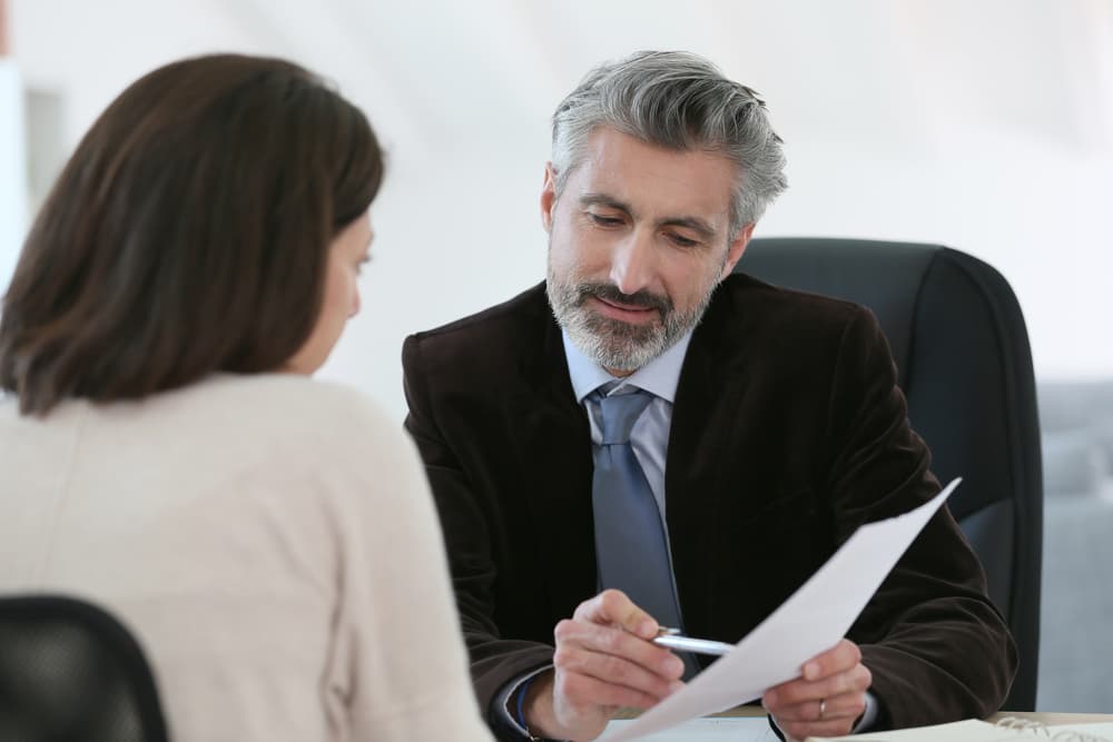 Lawyer having a meeting with a client in an office setting, discussing legal matters and providing professional counsel.