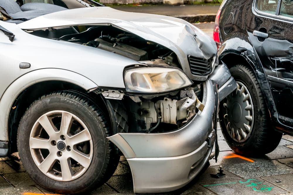 Sheet metal damage is a common occurrence for cars. Two cars crashed on the road.